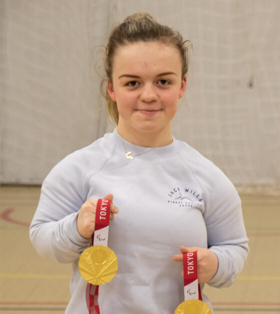 Maisie Summers-Newton, Athelete and Paralympic champion holding 2 gold medals